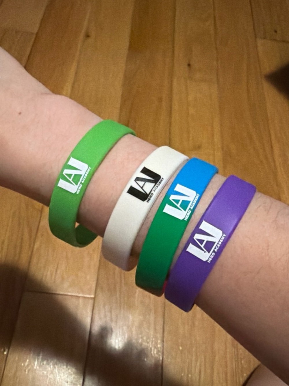 Set of Colorful Silicone Logo Wristbands - Green, White, Blue, Purple